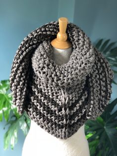 Hand Knit Outlander Inspired Season 4 Claire's Cowl, Chunky Knit, Shawl, Neck Warmer in gray/taupe color. The shawl is made from a 25% merino wool, 25% alpaca and 50% acrylic yarn. CARE: Wash in cold water, gentle cycle, lay flat to dry. The wing span is approximately: XS-S - 64-66 inches, M-L - 74-76 inches, XL-L - 82-86 inches. The knitted fabric is flexible and stretchy. All items are made from a high quality yarn in a pet and smoke free home studio. Knit Play Love is a one-woman operation. I Knit Acrylic Yarn Scarves, Winter Knitted Acrylic Yarn Shawl, Winter Knitted Acrylic Shawl, Winter Acrylic Yarn Knit Shawl, Winter Acrylic Knitted Shawl, Winter Knitted Yarn Shawl, One Size Knitted Shawl In Acrylic Yarn, Cozy Merino Wool Shawl For Winter, Knitted Alpaca Shawl Scarf