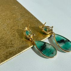 18KT yellow gold + cabochon, bezel set emerald teardrop earrings. Beautiful, unique emeralds were hand picked from Colombia. Measures: 63mm x 19mm 37 CT emeralds Omega backs Luxury Green Teardrop Earrings, Luxury Teardrop Cabochon Jewelry, Fine Jewelry With Cabochon Drop, Elegant Emerald Earrings With Bezel Setting, Fine Jewelry Drop Cabochon, Formal Green Teardrop Gemstone Earrings, Teardrop May Birthstone Earrings, Emerald Cabochon Earrings As A Gift, Emerald Cabochon Earrings For Gift