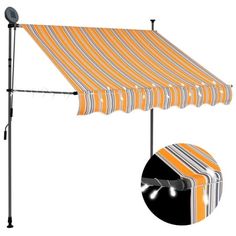 an orange and white striped awning next to a light