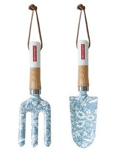 two gardening utensils with handles attached to them, one is blue and the other is white