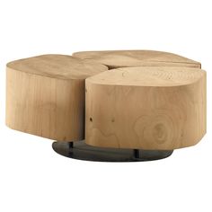 three wooden stools sitting on top of each other in front of a white background