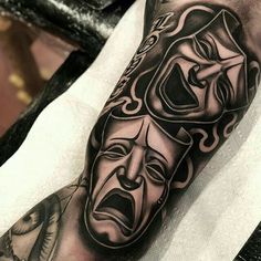 a man's arm with an evil mask on it and another demon in the background