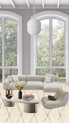 a living room filled with lots of furniture next to large windows on top of a white floor