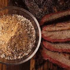 steak and seasoning in a bowl on a wooden table