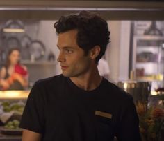 a man standing in front of a kitchen counter