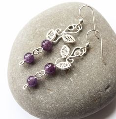 Graceful nature-inspired earrings will be handcrafted from sterling silver and your CHOICE of gemstone* (see second-to-last photo for options). Model piece made with amethyst. Earrings dangle ~2 inches from comfortable sterling silver french hooks (custom ear wires available upon request). Gift-wrapped as shown in last photo, perfectly ready to treat yourself or a special someone. *All colors are natural gemstones, except for the Swarvoski pearls and Rainbow Quartz. **This is a made-to-order ite Nature-inspired Sterling Silver Wire Wrapped Jewelry, Nature-inspired Wire Wrapped Earrings For Gifts, Nature-inspired Purple Sterling Silver Jewelry, Nature-inspired Wire Wrapped Dangle Earrings, Nature-inspired Silver Wire Wrapped Earrings, Nature-inspired Wire Wrapped Drop Earrings, Silver Wire Wrapped Nature-inspired Earrings, Nature-inspired Wire Wrapped Sterling Silver Earrings, Nature-inspired Silver Earrings With Natural Stones