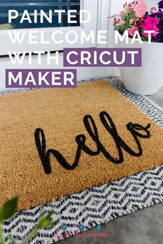 a welcome mat with the word hello painted on it in front of a potted plant