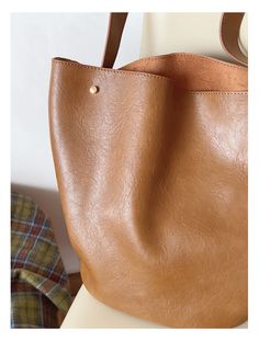 2024 New style. Simple leather bucket bag. Material: PU Leather Size: 11.8"H x 9.6"W x 6.2"D Designer Style ID: 8756 Chic Bucket Leather Bag with Shoulder Strap and Inner Pouch, Women's Everyday Handbag Solid Color Bucket Satchel For Travel, Office Bucket Bag, Classic Large Capacity Satchel Bucket Bag, Classic Large Capacity Bucket Bag Satchel, Solid Color Double Handle Bucket Bag For Shopping, Solid Double Handle Bucket Bag For Shopping, Solid Color Bucket Hobo Bag For Office, Brown Bucket Hobo Bag For Daily Use, Office Tote Hobo Bag Including Paper Bag