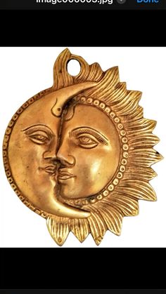 a gold sun and moon pendant on a white background with the words,'i love you