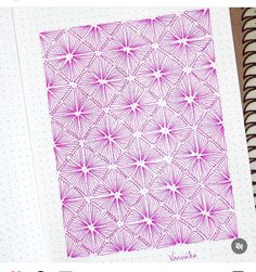 an open notebook with pink ink on it