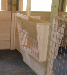 the inside of a wooden building with metal bars