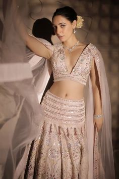 Pastel pink attached cancan lehenga with all over persian bagh embroideries using tonal sequins, pearl drops and beads highlights. Paired with padded embroidered blouse with plunging V neckline and attached ruffled hem wing sleeves. - Aza Fashions Glamorous Semi-stitched Pink Lehenga, Glamorous Georgette Lehenga With Pallu, Glamorous Pink Lehenga For Reception, Glamorous Pink Choli For Wedding, Glamorous Designer Pink Lehenga, Glamorous Pink Designer Lehenga, Glamorous Pink Designer Wear Choli, Glamorous Pink Lehenga For Wedding, Glamorous Pink Wedding Lehenga