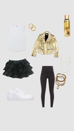 a woman's outfit with gold, black and white accessories