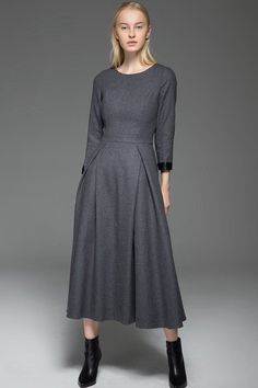 Exuding classic elegance with a contemporary twist. The classic long warm winter dress is impeccably tailored with beautiful pleats and darts for a body-slimming silhouette.  Perfect for smart casual styling, the warm wool dress is a versatile piece ideal for between-season as well as winter looks.  Impeccably handcrafted from soft wool, it falls below the knee so perfect to wear with long winter boots.  Pair yours effortlessly with a statement necklace and you're good to go!You may also like th Long Wool Dress, Winter Wool Dress, Warm Winter Dresses, Dark Clothing, Warm Dress, Gray Winter, Mode Abaya, Dress With Long Sleeves, Winter Dress