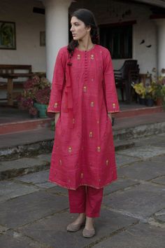 Earthy red long kurta with multi-color floral motif embroidery and loop button placket. Comes with pants.
Components:2
Embroidered
Neckline:Round
Sleeve Length:Three Quarter
Fabric:Handloom Cotton Silk
Color:Red
Loop buttons
Side slits
 - Aza Fashions Khadi Kurta, Red Kurta, Silk Kurta, Kurta Designs Women, Embroidered Neckline, Kurta With Pants, Silk Pants, Kurta Designs, Kurta Set