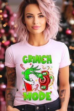 GRINCH MODE 100%COTTON HEATHER(52%COTTON,48%POLY) ATH.HEATHER,BLACK HEATHER(90%COTTON,10%POLY) Imported Size Measurement (inch): S: 36.0 (Bust), 18.0 (Waist), 18.0 (Hips), 28.0 (Length) M: 40.0 (Bust), 20.0 (Waist), 20.0 (Hips), 29.0 (Length) L: 44.0 (Bust), 22.0 (Waist), 22.0 (Hips), 30.0 (Length) XL: 48.0 (Bust), 24.0 (Waist), 24.0 (Hips), 31.0 (Length) Pink Graphic Print T-shirt For Winter, Winter Pink Graphic Print T-shirt, Pink Short Sleeve Winter Tops, Pink Short Sleeve Tops For Winter, Jumper Denim, Holiday Graphic Tees, Denim Short Dresses, Fall Shopping, Casual Fit