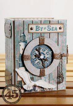 a card with an image of a clock and seagull on it, sitting on a table