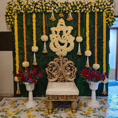 a decorated stage with flowers and decorations