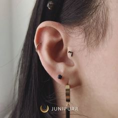 The Prong-Set Ball with Black Onyx piece is a popular decorative end that features a 3mm Onyx stone held by 3 prongs. Onyx is opaque, meaning no light shines through it. This threadless decorative end is available in 14 karat Yellow Gold, White Gold and Rose Gold options. Measuring 3.6mm, it can be used in any piercing that is fit with a threadless post from all major jewelry vendors. The second and third photos were taken by Javier Guerra and the fourth photo was taken by Trinity Kesterke. Item Jewelry Vendors, Snug Piercing, Jewelry Vendor, Forward Helix Piercing, Buddha Jewelry, Eyebrow Piercing, Tattoo Aftercare, Basic Jewelry, Traditional Earrings