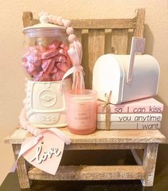 a wooden bench topped with lots of candy and candies next to a jar filled with sweets