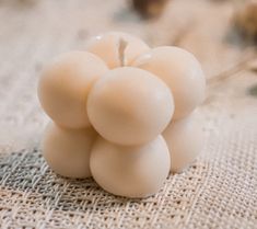 Bring warmth and coziness to any space with our Tiny Bubble Candle. In a soft light tan hue, this charming little candle exudes a comforting ambiance with its inviting scent, perfect for relaxing evenings or creating a cozy atmosphere. Its unique bubble design adds a stylish touch to any decor, making it a delightful addition to your home or a thoughtful gift for someone special. Bubble Candle, Ring Bearer Gifts, Bubble Design, Bridesmaid Proposal Box, Flower Girl Gifts, Bachelorette Party Gifts, Cozy Atmosphere, Instagram And Snapchat, Light Tan