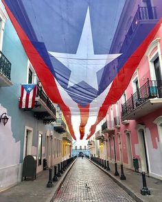 an american flag hanging from the side of a building