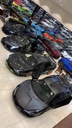 a group of cars parked in a showroom