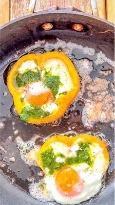 two eggs are being cooked in a frying pan