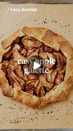 an apple pie with the words easy apple glaze written in front of it on a piece of parchment paper