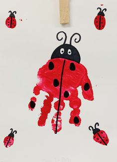 a child's handprint with ladybugs on it