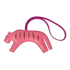 a pink plastic animal on a purple cord