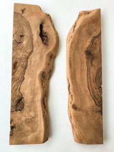 two pieces of wood sitting on top of each other