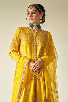 Yellow jacket-style kurta highlighted with intricate badla-pitta hand embroidery, pearl embellishments, round neckline and full sleeves. Comes with skirt and net dupatta.
Component: 3
Embroidered
Neckline: Round
Sleeve Length: Full
Fabric: Jacket and Lehenga: Summer Silk; Dupatta: Net
Color: Yellow
Badla, pitta and pearl embroidery
Embroidered dupatta
Note: The potli bag shown in the image is not for sale
Disclaimer: These are handwoven fabrics and there will be possibility of texture in it - Az Transitional Yellow Anarkali Set With Long Sleeves, Yellow Long Sleeve Anarkali Set For Transitional Season, Transitional Yellow Long Sleeve Anarkali Set, Yellow Kurta With Dupatta For Reception, Festive Yellow Kurta For Reception, Yellow Long Sleeve Sets For Reception, Yellow Long Sleeve Reception Set, Chanderi Sets With Gota Work And Long Sleeves, Fitted Sets With Gota Work For Designer Wear