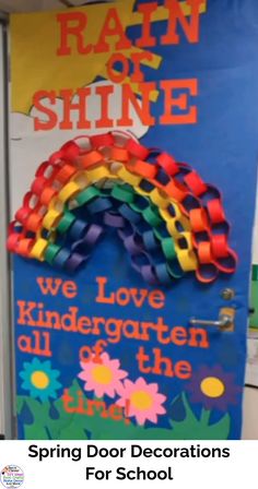 a door decorated with rainbows and the words, we love kindergarten all the time