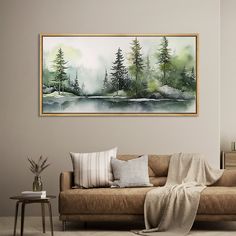 a living room scene with a couch, table and painting on the wall above it