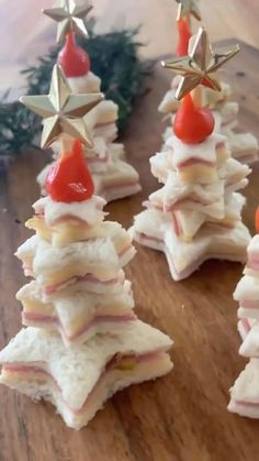 small christmas trees made out of crackers on a table