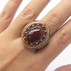 Great vintage condition.  RABBIGFIRLI 925 Sterling Silver Vintage Carnelian Red Garnet Gem Ring Size 11.25  Weight: 18.8g   WELCOME TO PAWN SHOP We are an actual pawn shop and have been in business for over 25 years. Since 1990, our establishment has been serving a variety of clients by providing them with short term cash solutions and options of liquidity regarding their treasured heirlooms. Acknowledging that today′s customers are very sophisticated and are looking for a variety of investments Vintage Red Signet Ring With Oval Cabochon, Vintage Red Oval Cabochon Signet Ring, Vintage Garnet Rings With Polished Finish, Heirloom Red Ruby Cabochon Ring, Heirloom Red Cabochon Ruby Ring, Heirloom Style Red Signet Ring With Gemstone, Heirloom Style Red Gemstone Signet Ring, Heirloom Red Signet Ring With Gemstone, Heirloom Red Gemstone Signet Ring