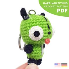 a crocheted keychain with a cartoon character on it's face