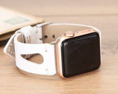 "Recycled smart watch band for daily use. Get a gift for yourself, for them!  Compatibility  * For Apple Watch 38/40/42/44/45 mm * Series 9-8-7-6-5-4-3-2-1-SE  Hardware Colors  -Apple Watch- * Rose Gold * Gold * Black * Silver * Space Grey -Fitbit Versa 1, 2, Lite- * Rose Gold * Gold * Black * Silver  Sizes  * Fits wrists between: 155mm-200mm / 6\"-7.80\" !! Request extra holes if needed please !!  Personalization  * Have your band engraved!  Shipping  * North America / 1-3 business days * Europa / 1-3 business days * Asia Pacific / 3-5 business days Have a second thought? Please contact me :)" Modern White Apple Watch Band For Everyday Use, White Adjustable Watch Accessories For Everyday Use, White Watch Bands With Bracelet Strap, White Leather Strap Watch Bands For Gift, White Leather Strap Watch Band As Gift, White Bracelet Strap Apple Watch Band For Everyday Use, Modern White Leather Strap Apple Watch Band, Modern White Leather Apple Watch Band, Modern White Watch Accessories As Gift