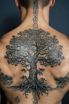 a man with a tree tattoo on his back