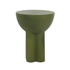 a green vase sitting on top of a white table