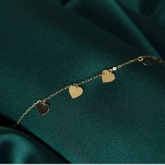 14K MULTIPLE HEART BRACELET - GOLD HEART BRACELET FOR WOMEN ❤️ ITEM DETAILS Material:14K Solid GOLD (Not filled or plated). Gold Bracelet Chain Length: 17cm Main Chain + 2cm Adjustable Chain Part Chain Width: 0,65mm Finish: 14K Yellow Gold Stone: Zİrcon ♥ SHIPPING We work with Dhl Express for worldwide shipping. Please leave your phone number at checkout for delivery purposes. Production time: 3-5 business days. ❤️ You May Also browse other Gold Bracelets Here: http://etsy.me/3qPFgMw ➤ ❤️ To bro Yellow Gold Charm Bracelet With Heart For Anniversary, Luxury Heart Cut Bracelet As Gift, 14k Yellow Gold Charm Bracelet With Heart Charm, Luxury Heart Cut Bracelet For Gift, 14k Gold Yellow Gold Charm Bracelet With Heart Charm, 14k Rose Gold Bracelet For Valentine's Day, 14k Gold Charms Bracelet Fine Jewelry, Luxury Yellow Gold Heart Bracelet With Heart Charm, Luxury Heart-cut Bracelet For Gift