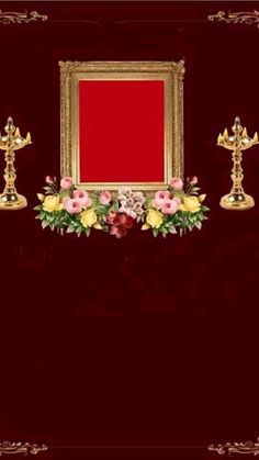 an ornate gold frame with flowers and candles in front of a red backdrop for a photo