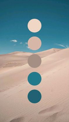 an abstract photo with circles in the middle of sand and blue sky above it on a sunny day