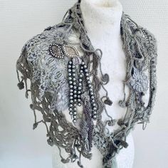 Handmade scarf made from knit and lace  collar in Grey  . Knit collar with beautiful lace scarf  It has a lovely texture , soft and warm . I have added jewellery and deco to give it a unique look of RawRags. This is a one of a kind item , ready made and can be send fast . Any questions please just ask and I will return as soon as possible . Elegant One-size Lace Shawl, Elegant One Size Lace Shawl, Winter Bohemian Shawl With Crochet Lace, Bohemian Crochet Lace Shawl For Winter, Winter Bohemian Crochet Lace Shawl, Bohemian Crochet Shawl As A Gift, Bohemian Crochet Lace Shawl, Bohemian Festival Hand Knitted Shawl, Bohemian Hand Knitted Shawl For Festival