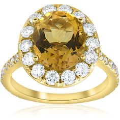 an oval cut citrine and white topazte ring in yellow gold with diamonds