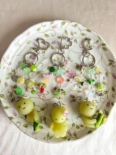 a white plate topped with lots of key chains