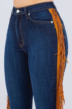 Look like you rodeoed your way to wardrobe perfection in these fringe bell bottoms! Made with a premium soft stretch denim for a great fit and dark blue for badass vibes, these 34" inseam jeans have sides fringe detail and functional pockets front and back. Saddle up for style.This garment is MADE TO ORDER and is Final Sale. Style: high rise Silhouette: bell bottom Embellishment: fringe tassels Length: full length Closure: zipper, button Made In: USAFabric Contents: 52% RAYON26% COTTON21% POLYES Trendy Straight Leg Bottoms With Fringe, Trendy Fringed Jeans For Fall, Trendy High Waist Fringe Jeans, Trendy Fringe Jeans For Fall, Straight Leg Bottoms With Fringe For Fall, Trendy Fitted Fringe Jeans, Trendy Straight Leg Jeans With Fringe, High-rise Denim Blue Jeans With Fringe, High Rise Denim Blue Jeans With Fringe