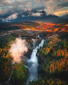 an aerial view of a waterfall surrounded by trees and mountains in the background with text overlay that reads, bestofeartravel washington