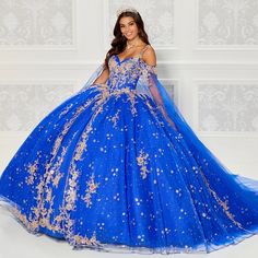 This beautiful V-neck sleeveless quinceanera dress features delicate embroidered lace and ice cracked details; and the glittery tulle skirt with more embroidery and beading details. It also includes a beautiful detachable off-the-shoulder cape. Quinceanera Dresses Damas, Fabric Beading, Damas Dresses, Shoulder Cape, Princess Sleeves, Dresses Quinceanera, Baptism Dress, Quinceanera Dress, Full Length Skirts